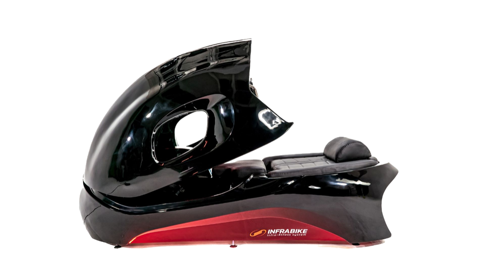 Man using INFRABIKE® infrared cycling machine — zero-gravity workout